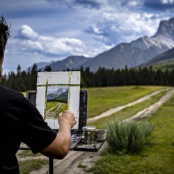 Unknown Artist Painting The Three Sisters In Canmore Alberta Canada